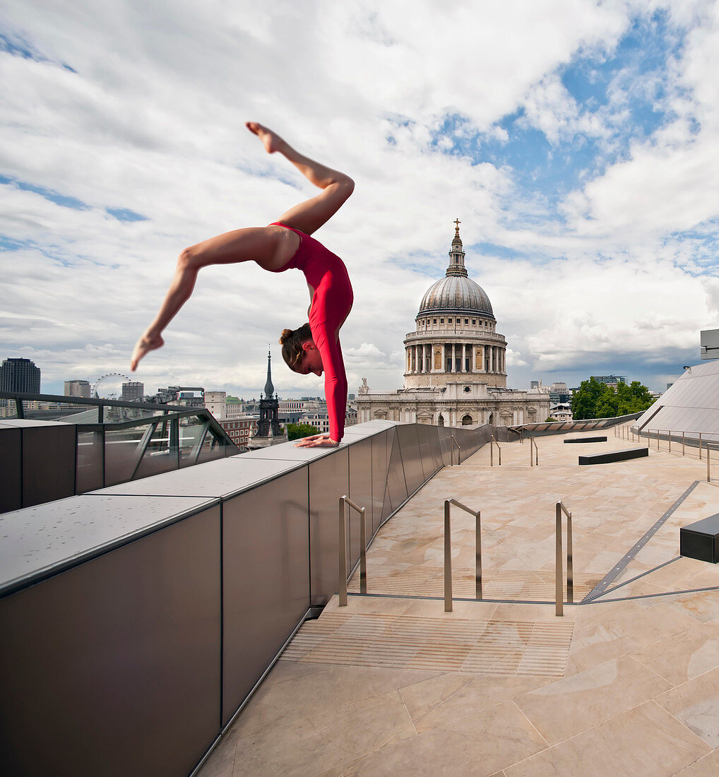 Gymnast on urban rooftop. Gymnast on urban rooftop