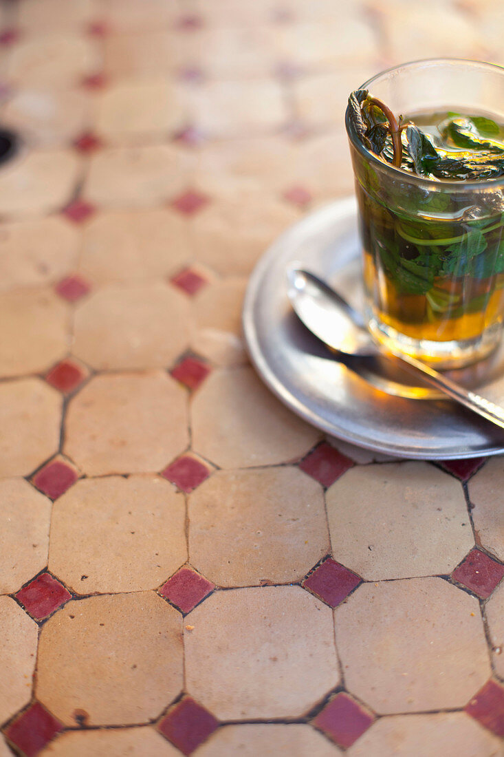 Glass of mint tea on restaurant table. Mint tea, Marrakech, Morocco