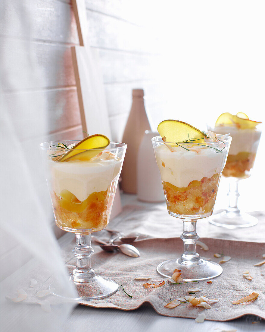 Glasses of mango coconut trifle. MangoCoconutTrifle