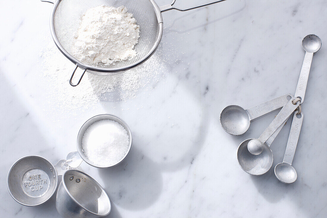 Flour with measuring cups and spoons. QSCOpenerBasics