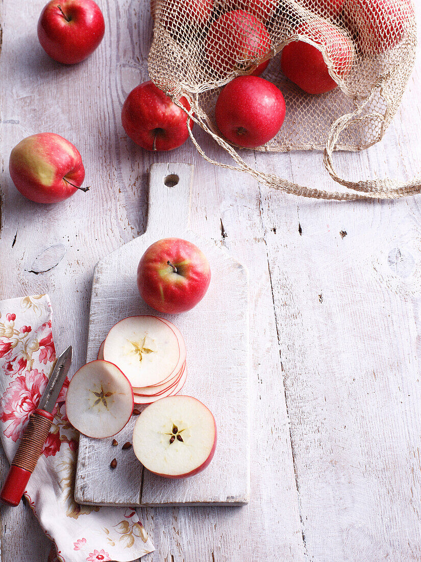 Sliced apples on wooden board. Apples
