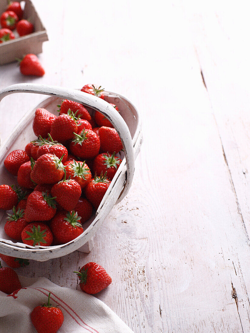 Basket of strawberries on table. Strawberries