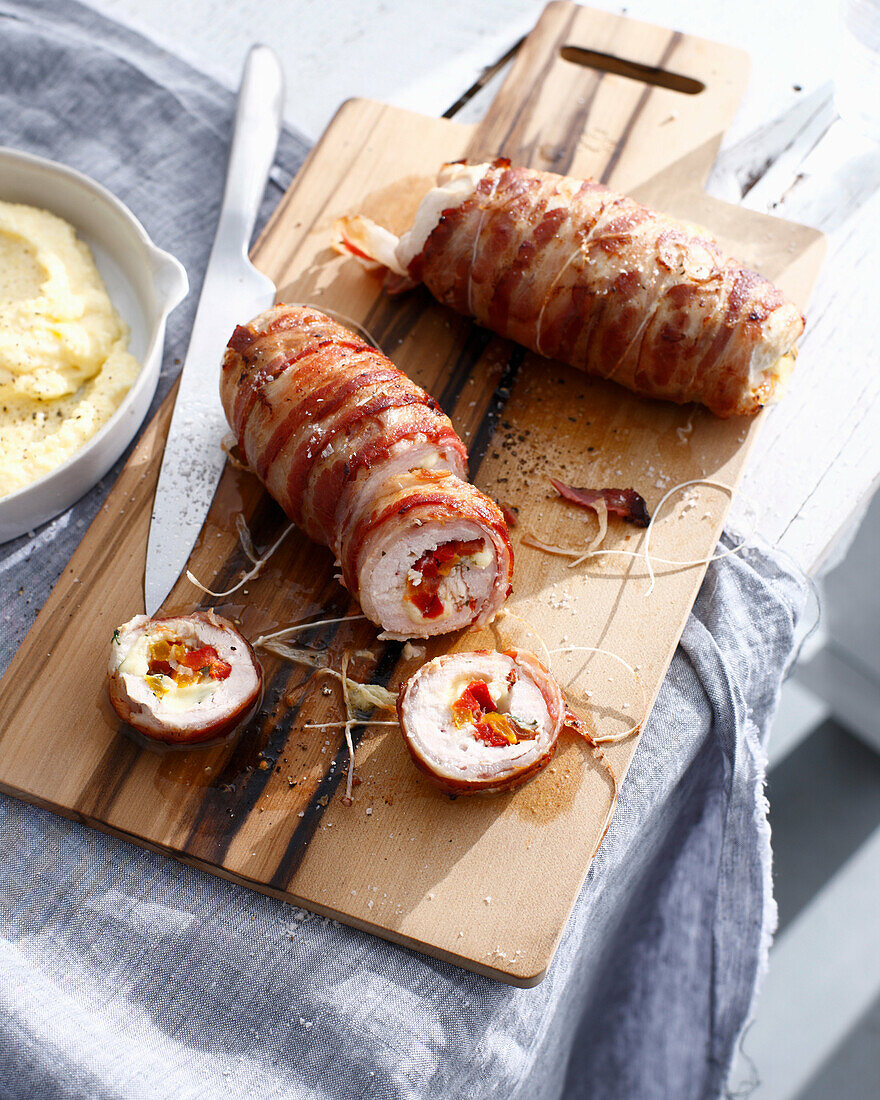 Chicken involtini on wooden board. ChickenInvoltiniA