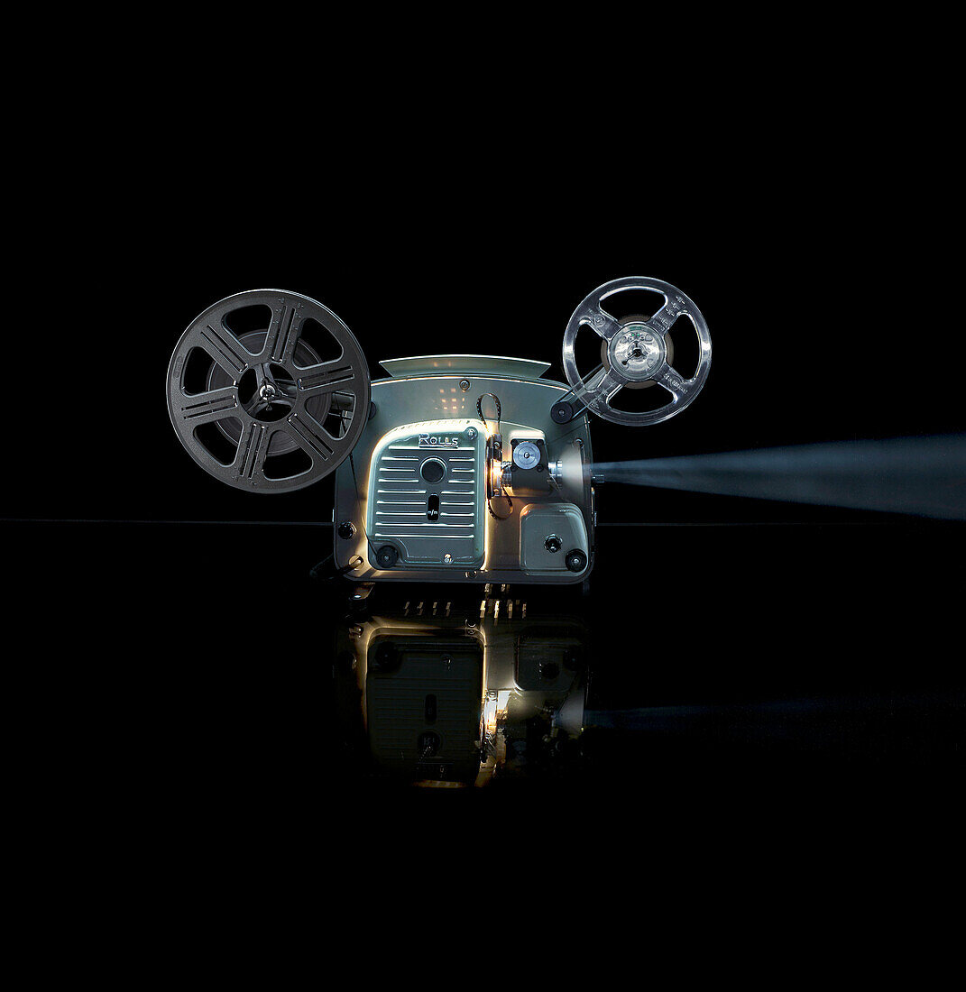 Glowing movie projector with reel. Movie Projector, Cine film, Technology, Still Life