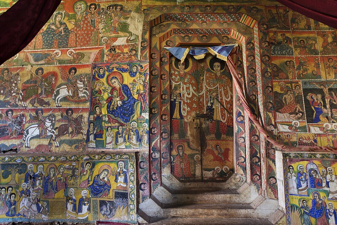 The monastery Ura Kidane Meret, Zege peninsula of Lake Tana in Ethiopia  the church is beautifully painted  The frescos are showing stories of the new and old testament as well as miracles of saints  All saints, angels or people are painted with black ski