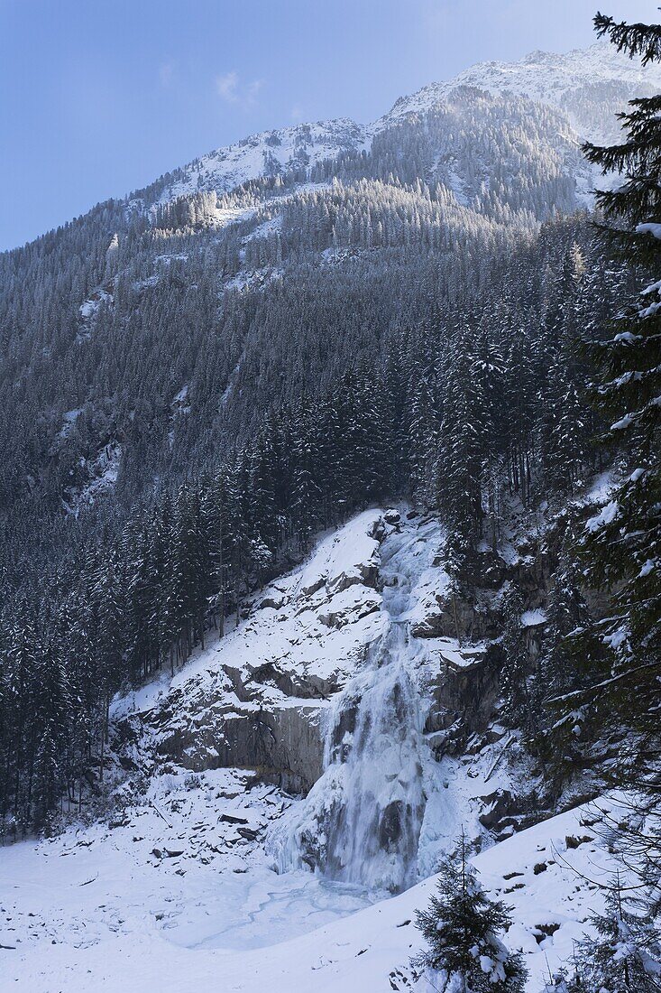 The Krimml waterfalls in the National Park Hohe Tauern during winter in ice and snow  The lower Fall The Krimml waterfalls are one of the biggest tourist attractions in Austria and the Alps  They are visited by around 400 000 tourists every year  The wate