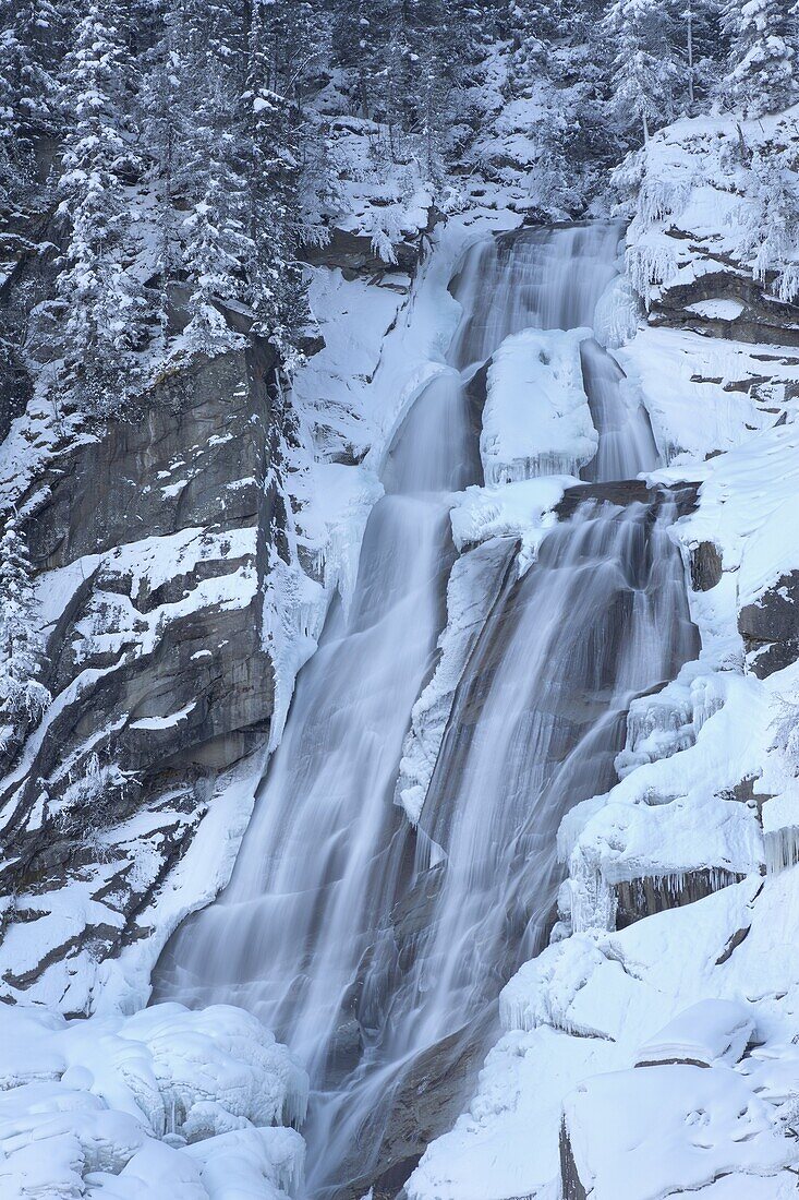 The Krimml waterfalls in the National Park Hohe Tauern during winter in ice and snow  The upper Fall  The Krimml waterfalls are one of the biggest tourist attractions in Austria and the Alps  They are visited by around 400 000 tourists every year  The wat