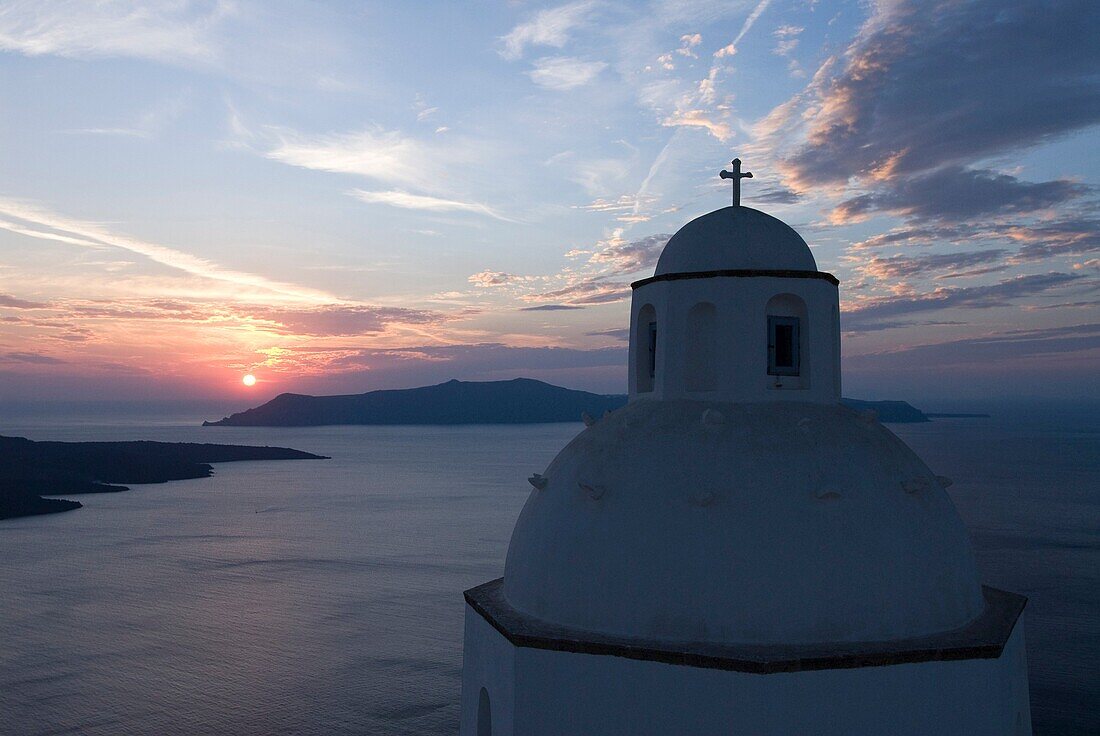 Greek Orthodox Church at sunset, Fira, Santorini, Greece