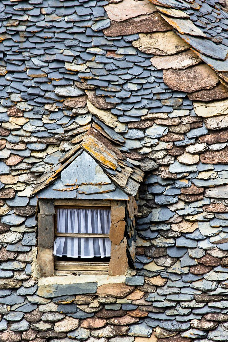 Slate roof and mansard in a house typical Erill la Vall - Vall de Boi - Pyrenees - Lleida Province - Catalonia - Cataluña - Spain