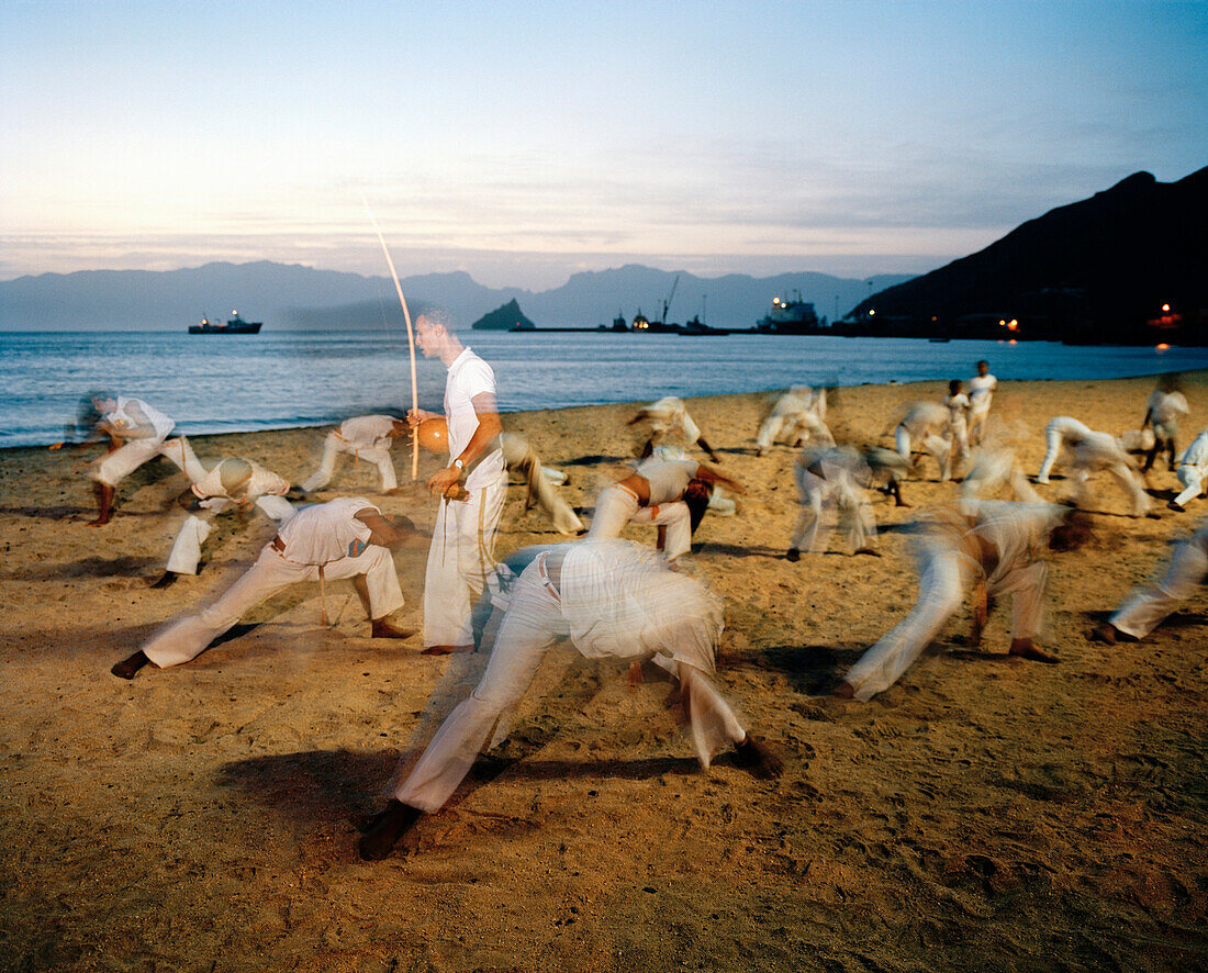 Children and teenagers practicing Capoeira at Laginha beach in the evening, Mindelo, Sao Vicente, Ilhas de Barlavento, Republic of Cape Verde, Africa