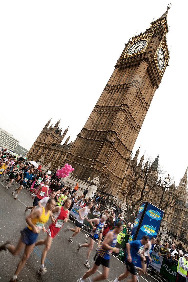 Runners near Big Ben at the London Marathon, London, England, Great Britain