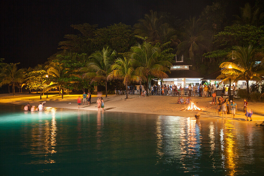 Beach party with bonfire at night, Port Antonio, Portland, Jamaica, Caribbean