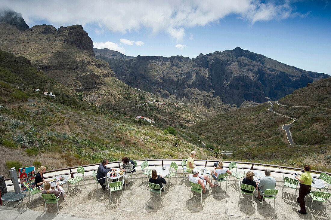People on a terrace at the mountain village of Masca in the Teno mountains, Tenerife, Canary Islands, Spain, Europe