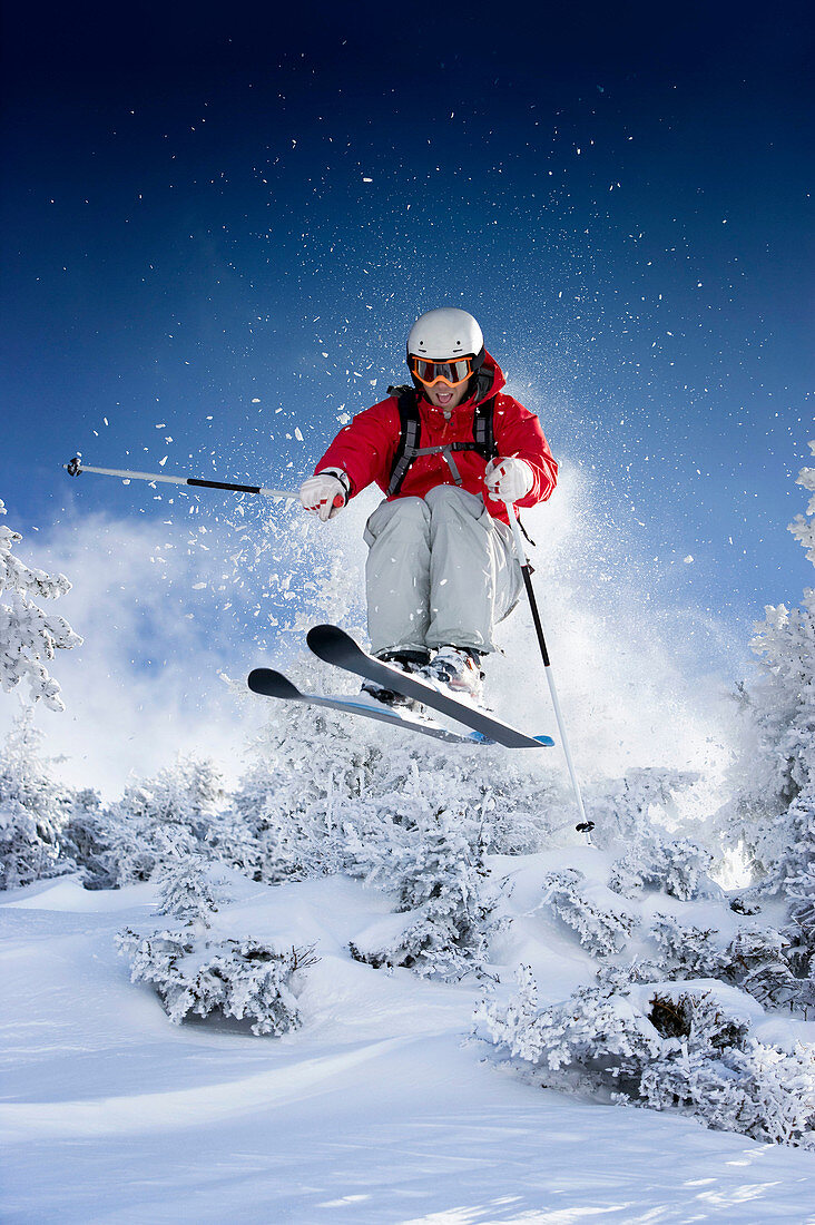 Skier jumping towards camera