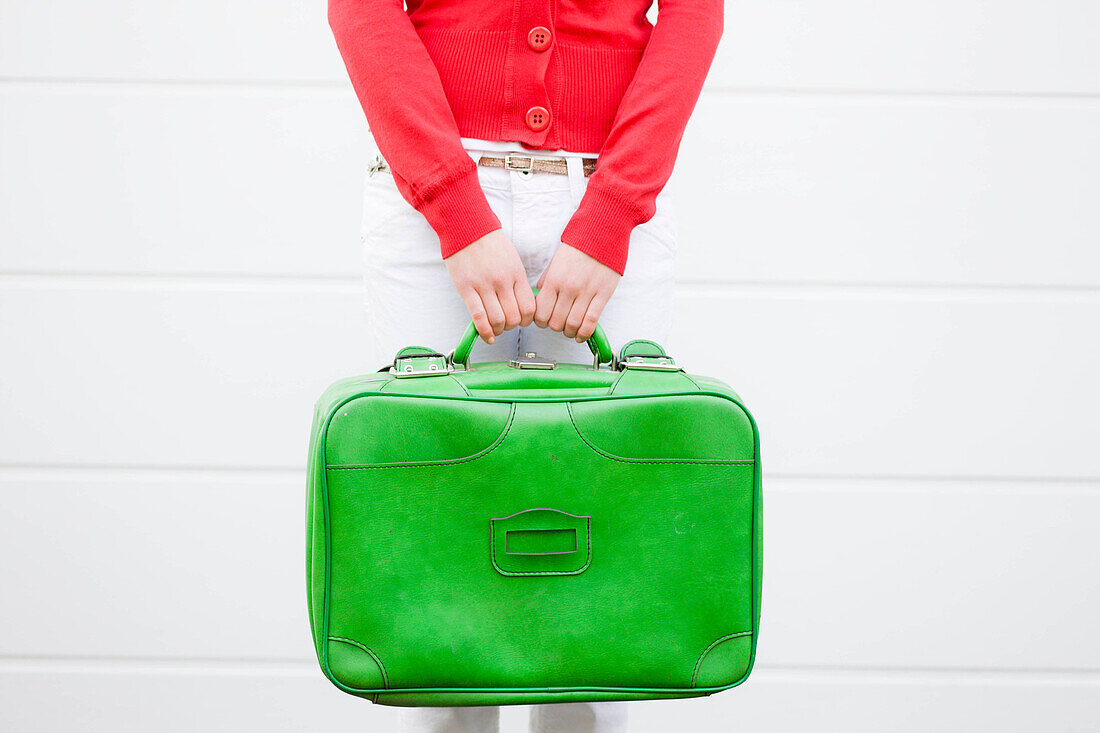 Girl holding suitcase. Girl holding suitcase