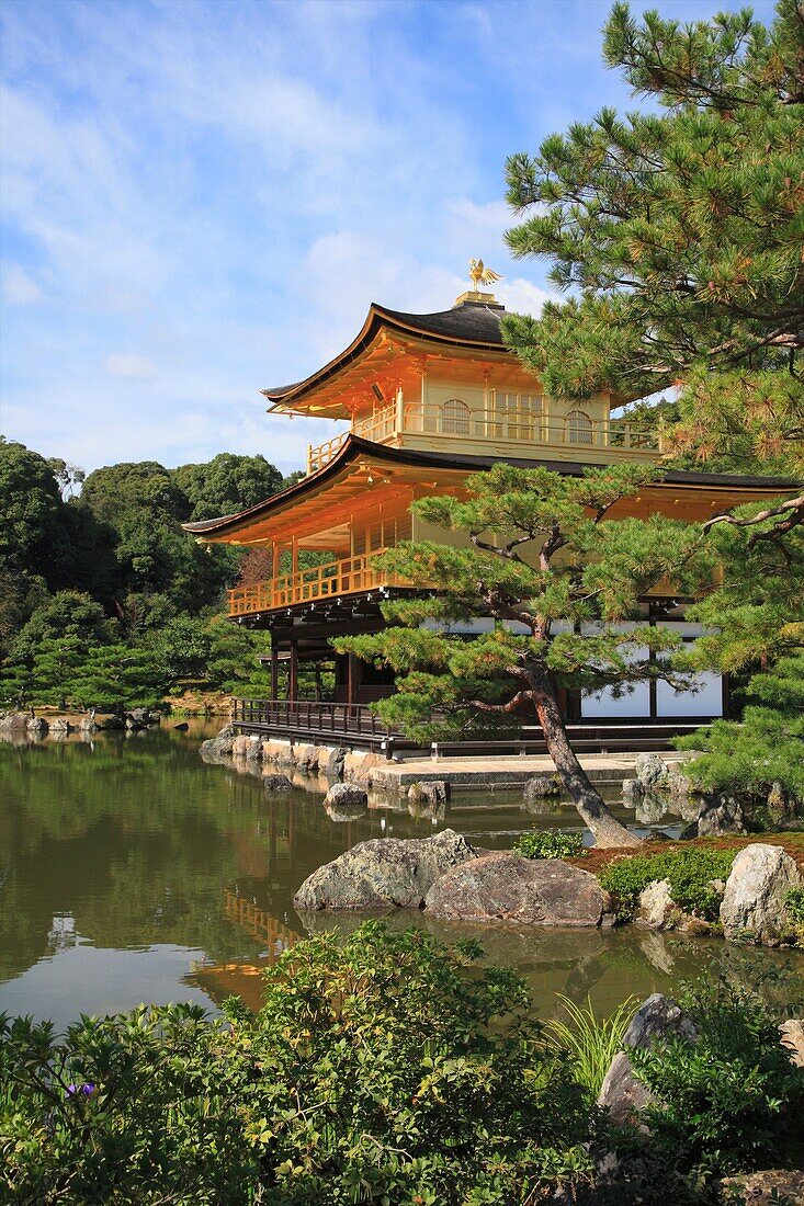 Kinkaku-ji, Kyoto, Japan  The Golden Pavilion, or Kinkaku, is a three-story building on the grounds of the temple  The top two stories of the pavilion are covered with pure gold leaf  The pavilion functions as a shariden, housing relics of the Buddha  On