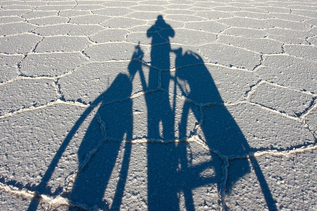 Shadow of a biker on the frozen salt lake called ´Salar de Uyuni´ in Bolivia