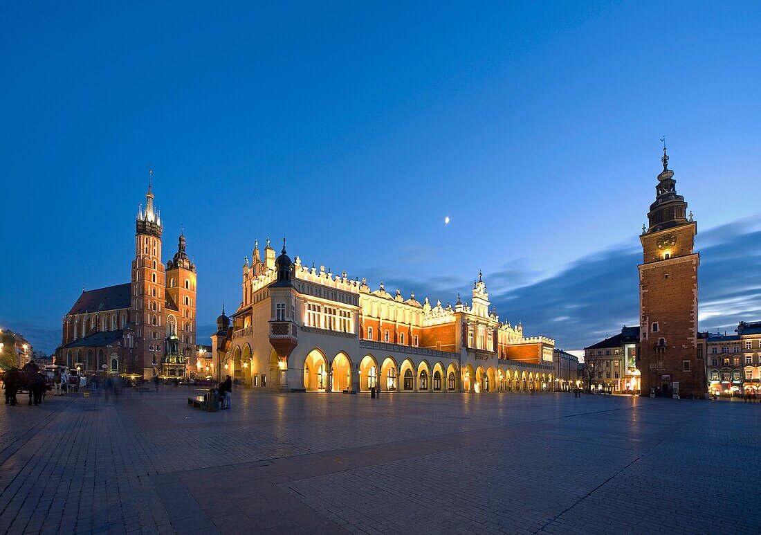 The Cloth Hall, St Mary the Virgin Basilica and Town Hall at Main Market Square at dusk, Krakow, Poland, Europe