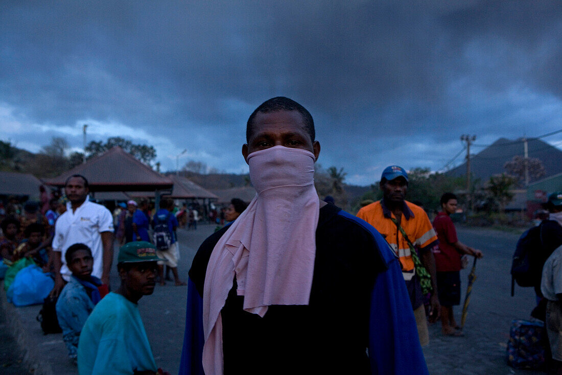 Man with dust mask, Market in Rabaul, Tavurvur Volcano, Rabaul, East New Britain, Papua New Guinea, Pacific