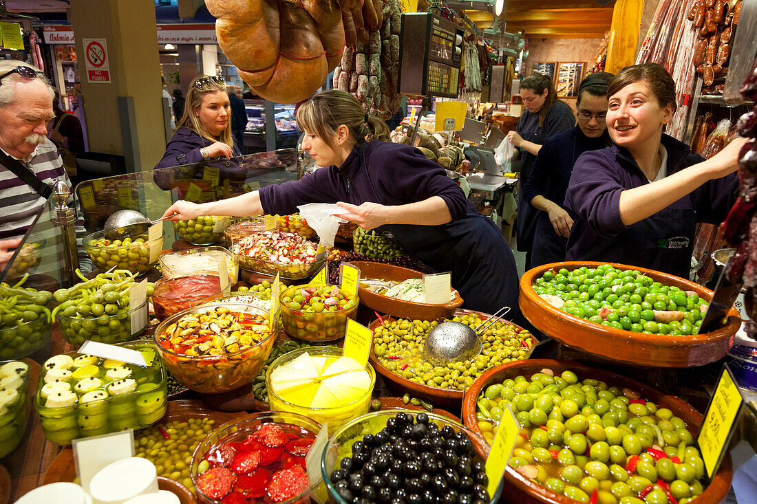 Mercat Olivar, market hall, center of Palma, market-woman selling olives, fresh food, antipasti, shopping, Palma de Mallorca, Mallorca, Spain