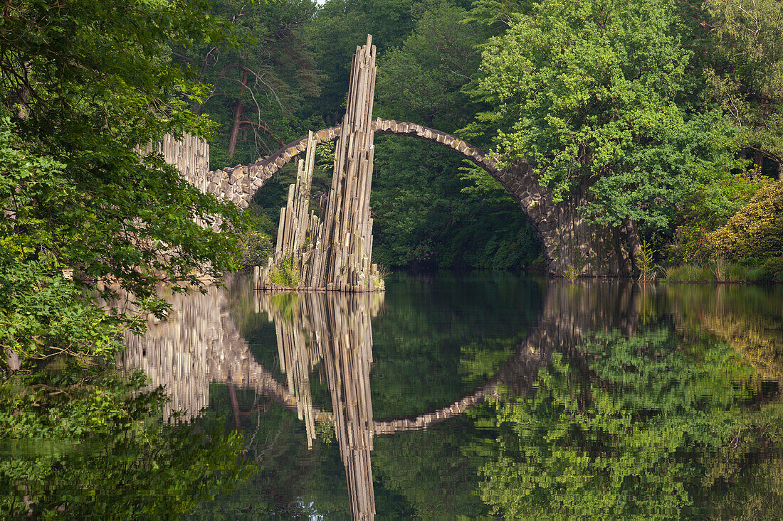 Rakotz bridge reflecting in lake Rakotzsee, Kromlau park, Kromlau, Saxony, Germany, Europe