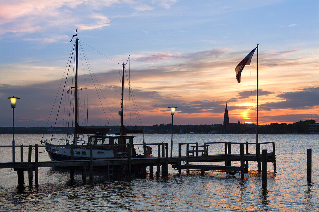 View from a pier onto the cathedral St Petri at sunset, Schleswig, Schlei fjord, Baltic Sea, Schleswig-Holstein,  Germany, Europe