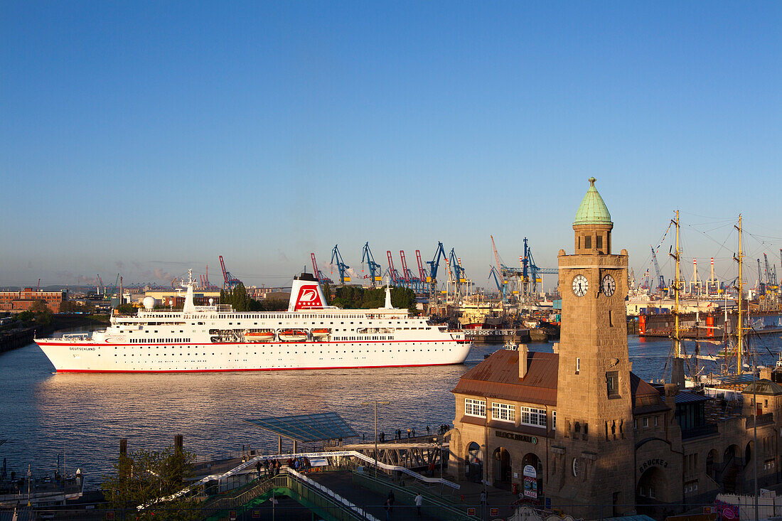 Cruise ship MS Deutschland entering port at the tower of St. Pauli Landungsbrücken, Hamburg, Germany, Europe