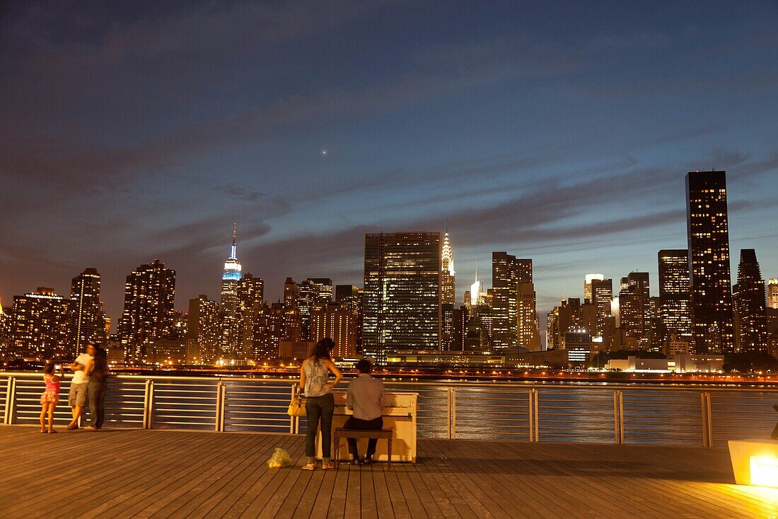 New York - United States, people admiring the buildings by night