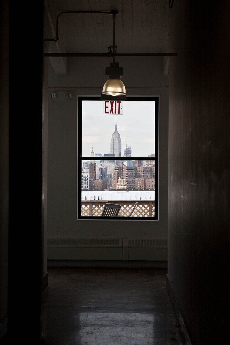 New York - United States, panoramic view on Manhattan skyline and the Empire State building, from artist lofts in Dumbo area