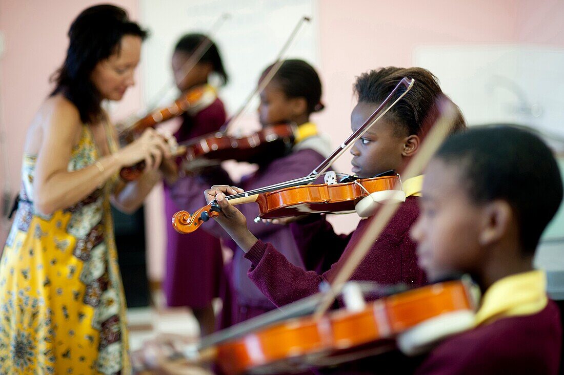 South Africa, Cape Town, Township of Gugulethu, Primary school, students playing violin