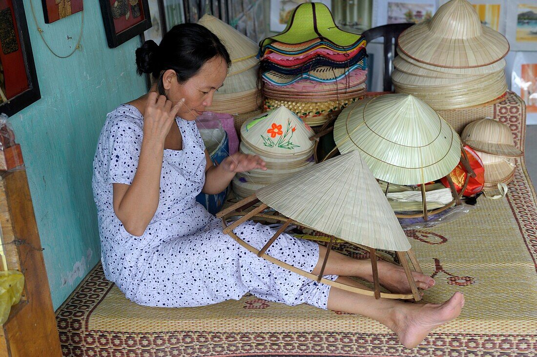 Asia, Southeast Asia, Vietnam, Centre region, Hue, old woman weaving hats