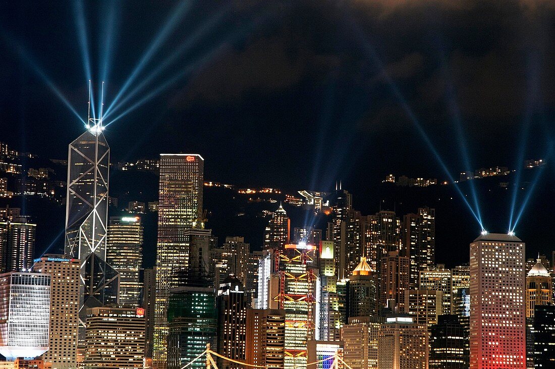Laser show over city at night, Hong Kong, China