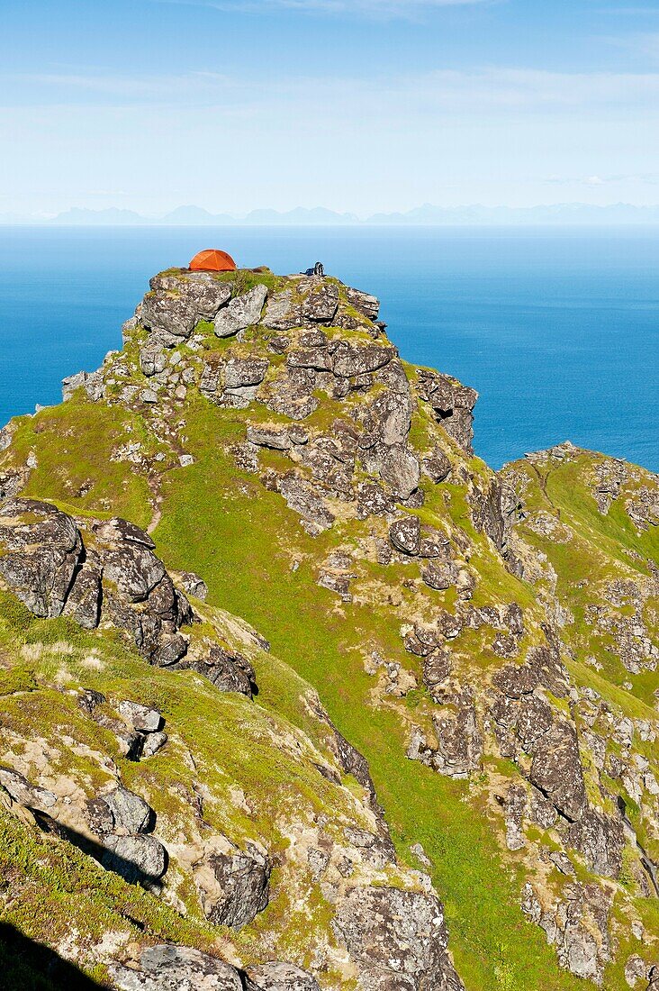 Tent camping on Reinebringen mountain peak, Reine, Lofoten islands, Norway