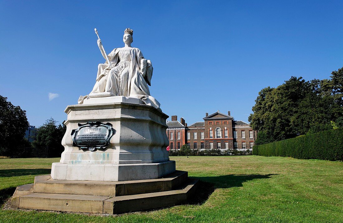 Statue of Queen Victoria by her daughter Princess Louise, outside Kensington Palace, London, UK