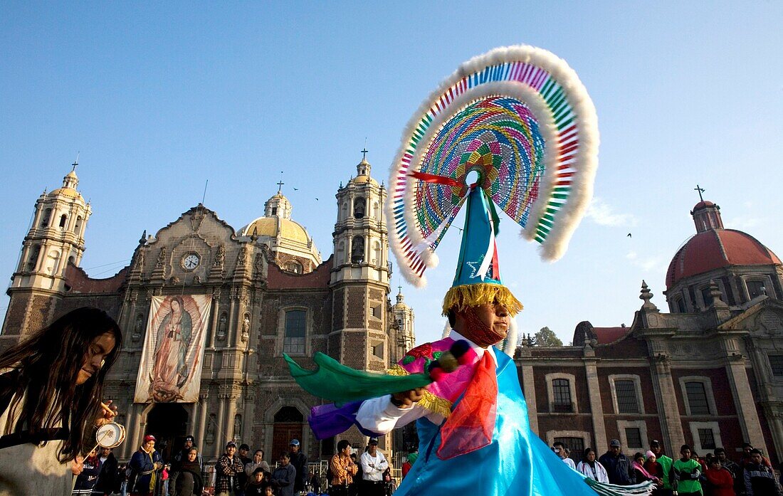 A Bird Men dances outside the Basilica of Guadalupe in Mexico City, December 11, 2007  ´Bird Men´ perform an ancient Totonacan ceremony asking for a good harvest and fertility, which originated in the Gulf of Mexico´s Veracruz state  Hundred of thousands
