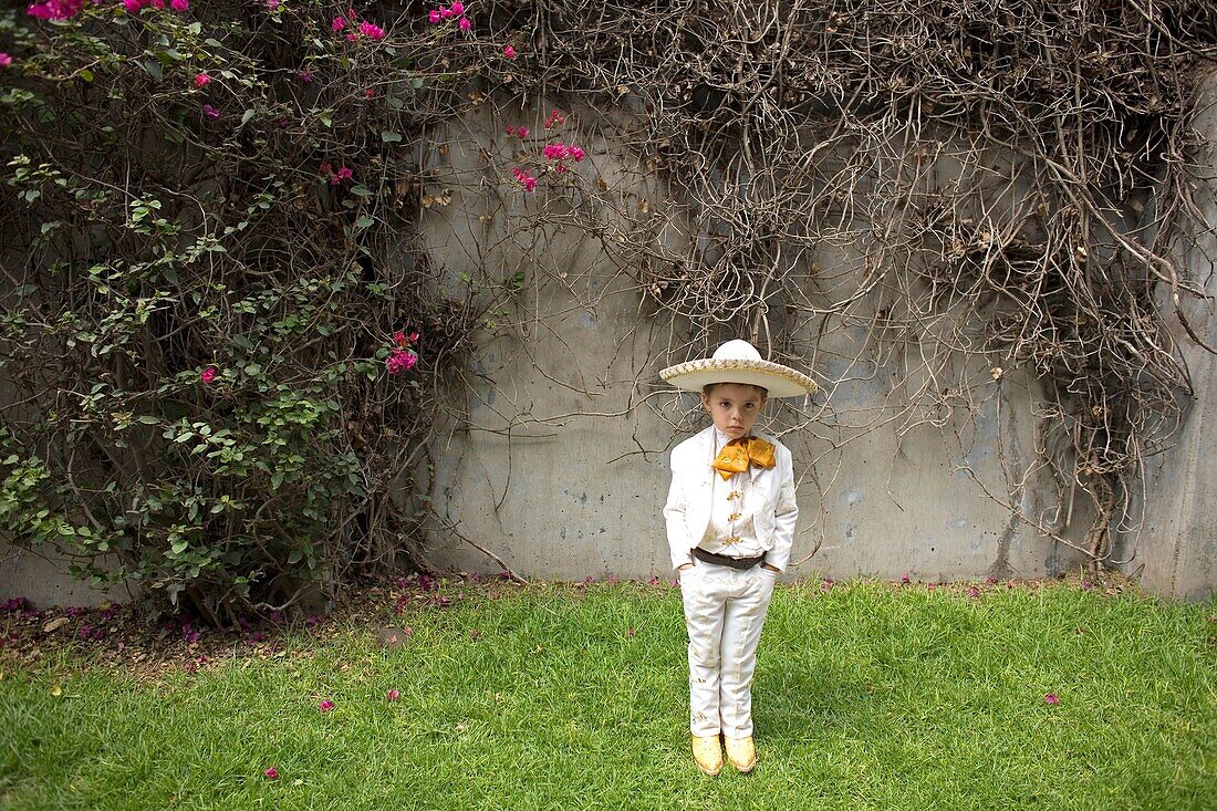 A boy dressed as a Mexican charro pose for a picture in Mexico City, August 17, 2008  Male rodeo competitors are ´Charros, ´ from which comes the word ´Charreria ´ Charreria is Mexico´s national sport