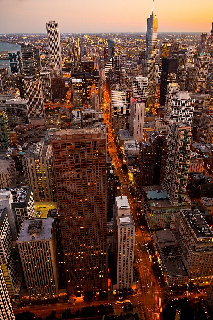 Sunset over the Chicago skyline looking south from the Hancock Tower along the lake front in Chicago, IL, USA