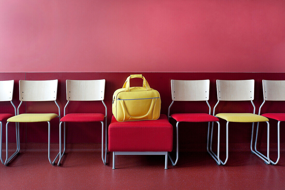 The maternity unit at a women's hospital. Public area, corridor and waiting room. Rows of chairs. A large yellow bag., Tartu University Women`s Hospital, Estonia
