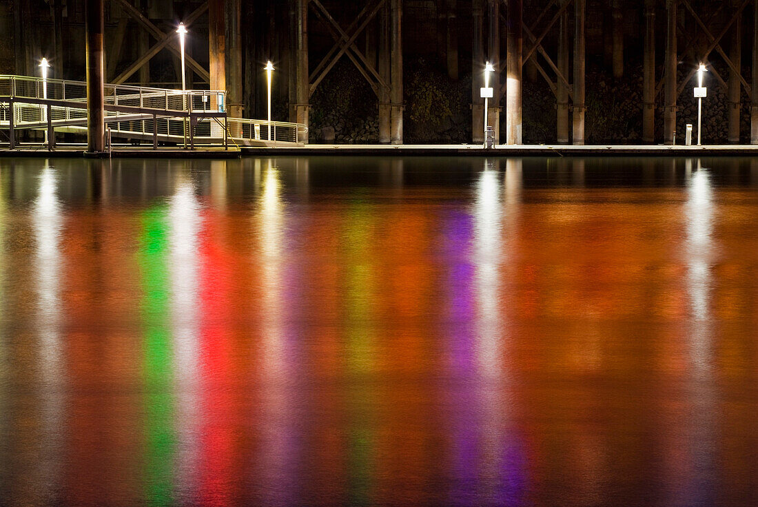 Neon lights reflect off Sacramento River at night, Sacramento, California, USA., Neon lights reflect off Sacramento River at night