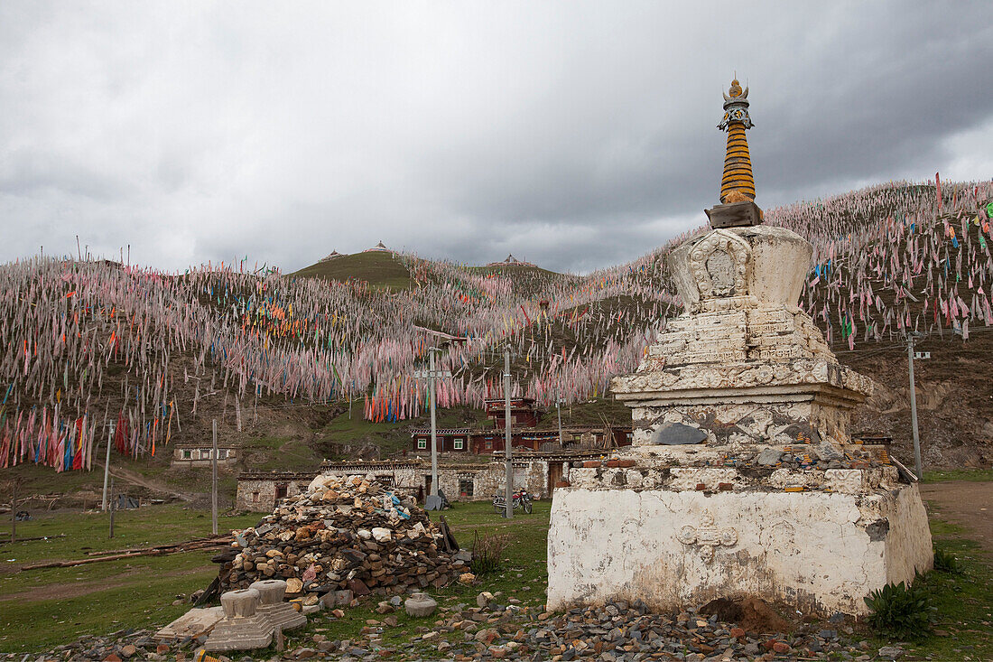 A traditional sky burial site. A traditional practise of leaving a body on a hillside for the elements and the vultures to dispose of. Tagong jhator. A large collection of prayer flags. Stupa., Sichuan Tibet