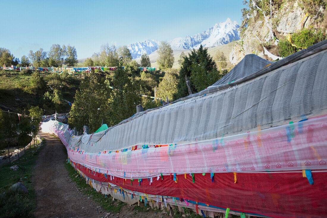 Repotacha or religious Meditation Retreat.A Buddhist place of pilgrimage. Local people come in Summer for blessings. On the road between Ganzi and Manigango. Prayer flags along the road. Mountain landscape., Sichuan Tibet