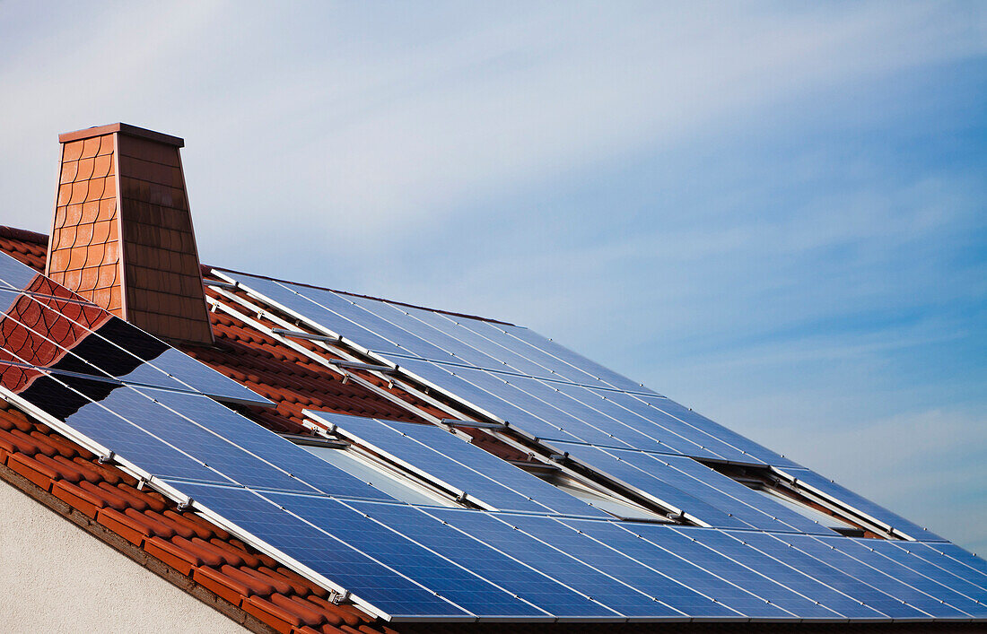 Photovoltaic solar panels mounted on the roof of a German house., Solar Panels on house, Germany