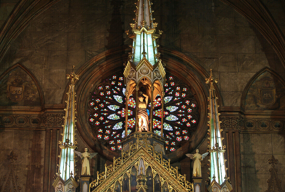 Statue and old painted glass window in Basilica de San Sebastian, the only all steel church in Asia, Manila, Philippines, Asia