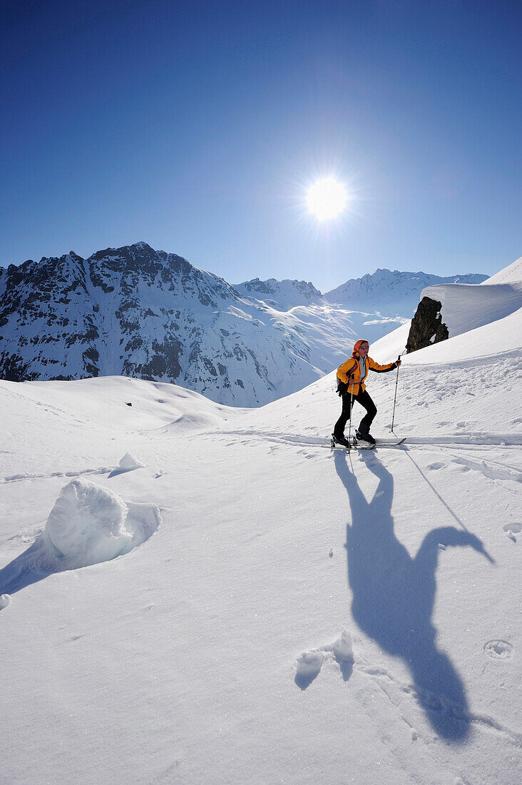 Woman backcountry skiing, ascending towards Madrisajoch, Madrisajoch, Raetikon, Montafon, Vorarlberg, Austria