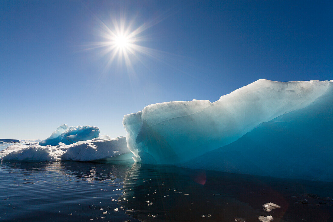 Blue icebergs, sun, Antarctic Sound, Weddell Sea, Antarctica