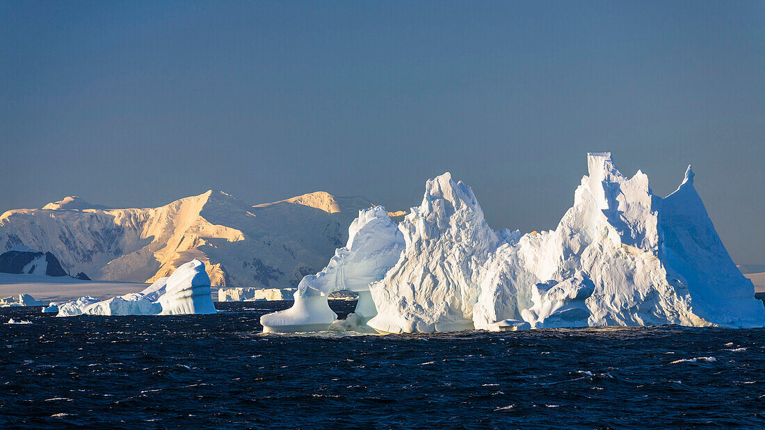 Iceberg at sunrise on antarctic circle, Adelaide Island, Antarctic Peninsula, Antarctica