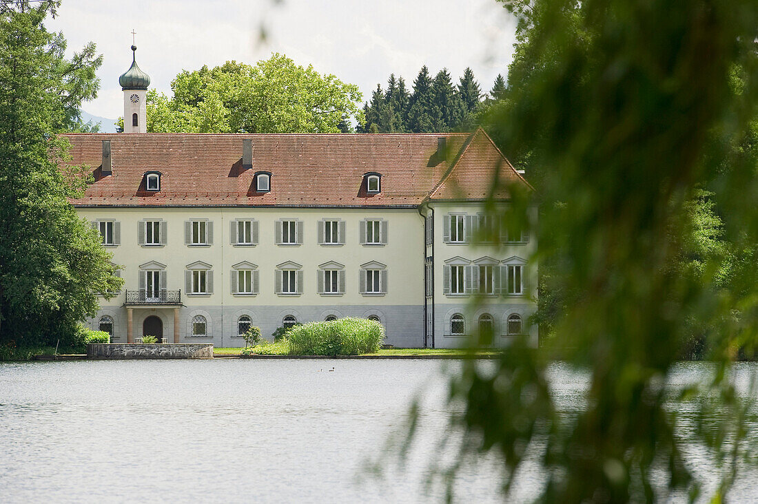 Hartmannsberg Castle and Lake Schlosssee near Eggstaett, Chiemgau, Bavaria, Germany