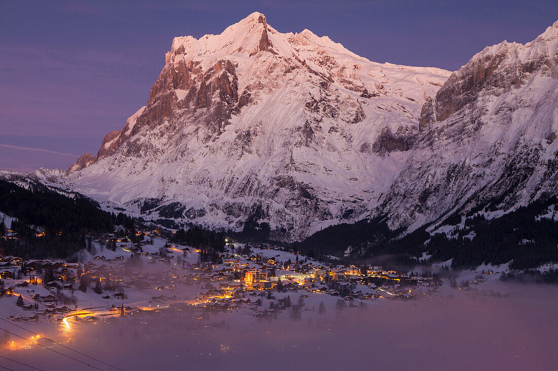 Dusk above Grindelwald and the Wetterhorn, Winter Ski Resort in the Jungfrauregion, Bernese Oberland, Canton Bern, Switzerland, Europe