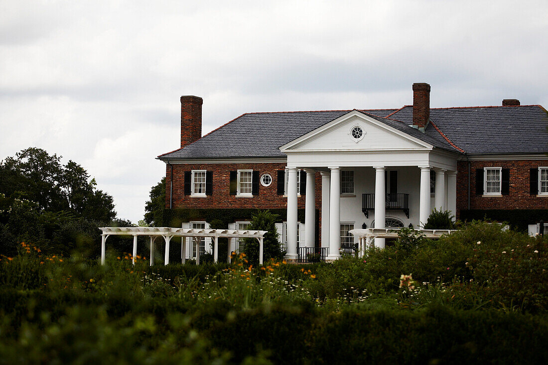 Large Brick House With White Columns