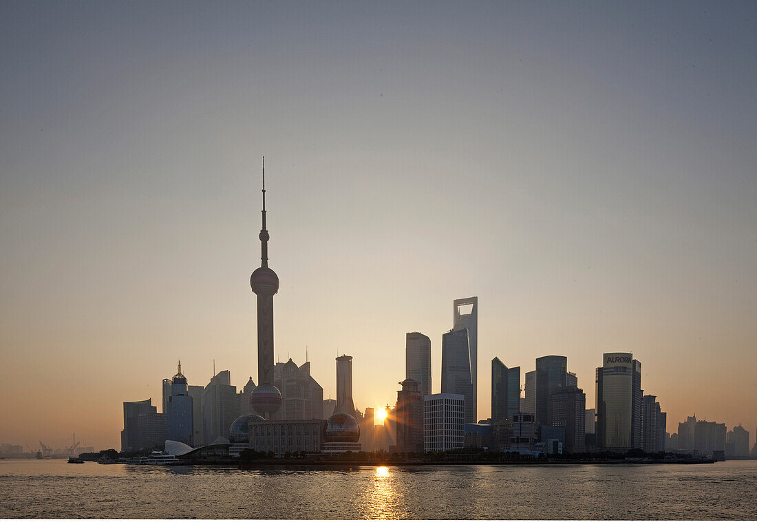 Skyline of Pudong at the Huangpu River at sunrise, Pudong, Shanghai, China, Asia